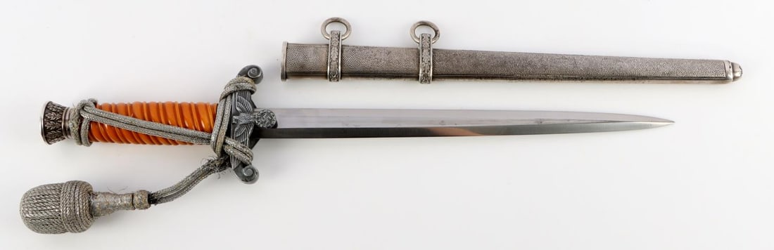 WWII GERMAN THIRD REICH ARMY HEER DAGGER: Steel blade with WKC maker's mark. Pommel appears to be silver plated nickel while crossguard is bare nickel. Grip is bakelite with fading on one side due to age. Scabbard is pebbled variant. Tang is