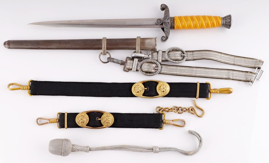 WWII GERMAN THIRD REICH HEER DAGGER AND HANGERS: Steel blade with Gustav Spitzer maker. Crossguard is nickel with silvered finish as well as the pommel. Grip is Bakelite. Very good condition. Scabbard not likely original to dagger. It measures 15 3/