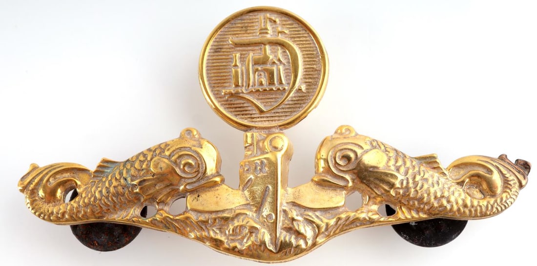 VINTAGE DISNEYLAND SUBMARINE EMPLOYEE BADGE: Vintage Disneyland Submarine Employee Badge. Front shows a submarine in the center flanked by a dolphin on each side. Above is a round button with a ?D? that has the Disneyland castle in the back grou
