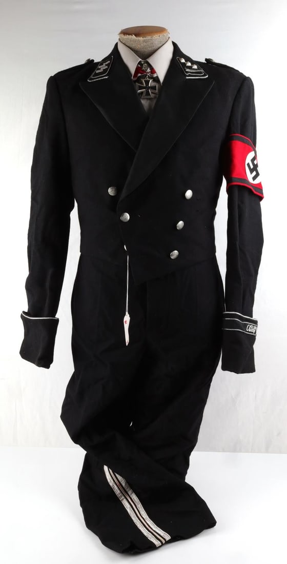 INGLORIOUS BASTARDS SCREEN WORN PROP SS UNIFORM: Screen worn SS usher prop uniform, including jacket, trousers, shirt, slacks and Certificate of Authenticity. Jacket has "Siam Costumes" tailor tag on interior. Good overall condition.