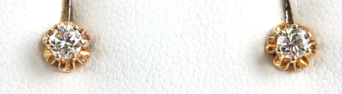 .25 CTW DIAMOND 14K YELLOW GOLD STUD EARRINGS: Stamped '14K" each diamond measures approx .125 carat. Total weight 1.3 grams. This lot has a reserve.