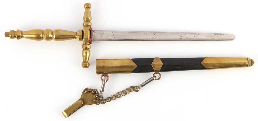 MID 20TH CENT ITALIAN DAGGER W HANGER & SCABBARD: Believed mid 20th century, good leather and brass scabbard, copper ringlets hold brass hanger, unmarked blade that ends in a blunt hewer style, overall all in scabbard measures 12 1/4 inches