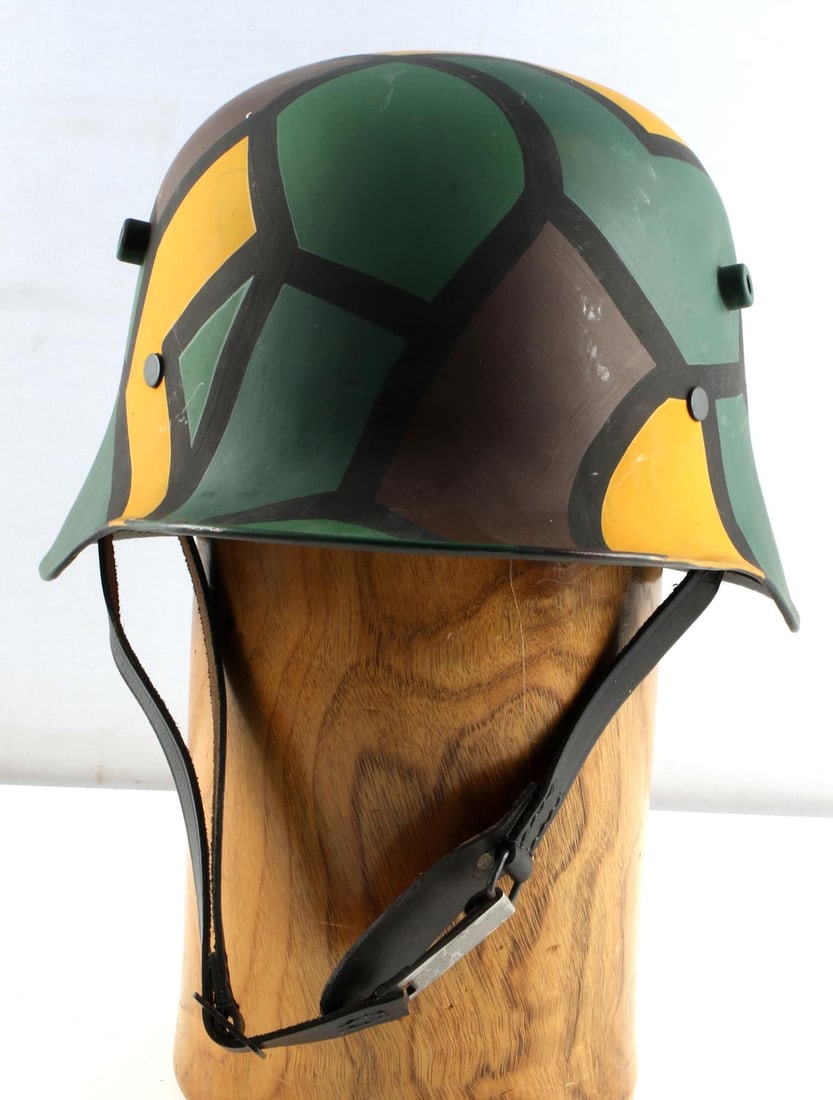 WWII THIRD REICH GERMAN CAMO COMBAT HELMET: WWI camo colors, white leather liner, black leather chinstrap. Front to back inside measurement is 9 inches. Very good condition. Unauthenticated, sold as is.