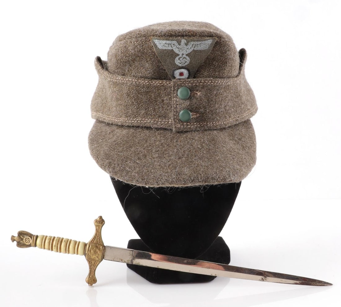 WWII GERMAN REICH KRIEGSMARINE OFFICERS DAGGER: Also includes mini M43 mountain cap. Measures 7 3/8 inches long in total. In good overall condition. Some surface wear on blade. No scabbard included.