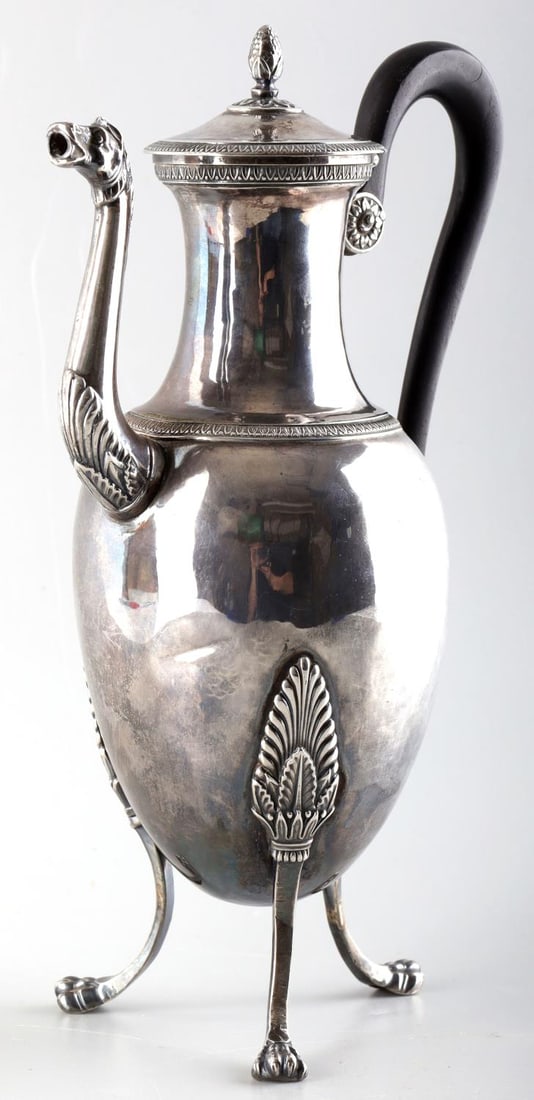 19TH CENTURY FRENCH EMPIRE SILVER COFFEE POT: French Empire neoclassical Minerva silver tripod coffee pot . Condition: overall good with contact indentures noted on body please review photos. Monogrammed W. Height 9 1/2 inches.. Size: RM cab 1 Th