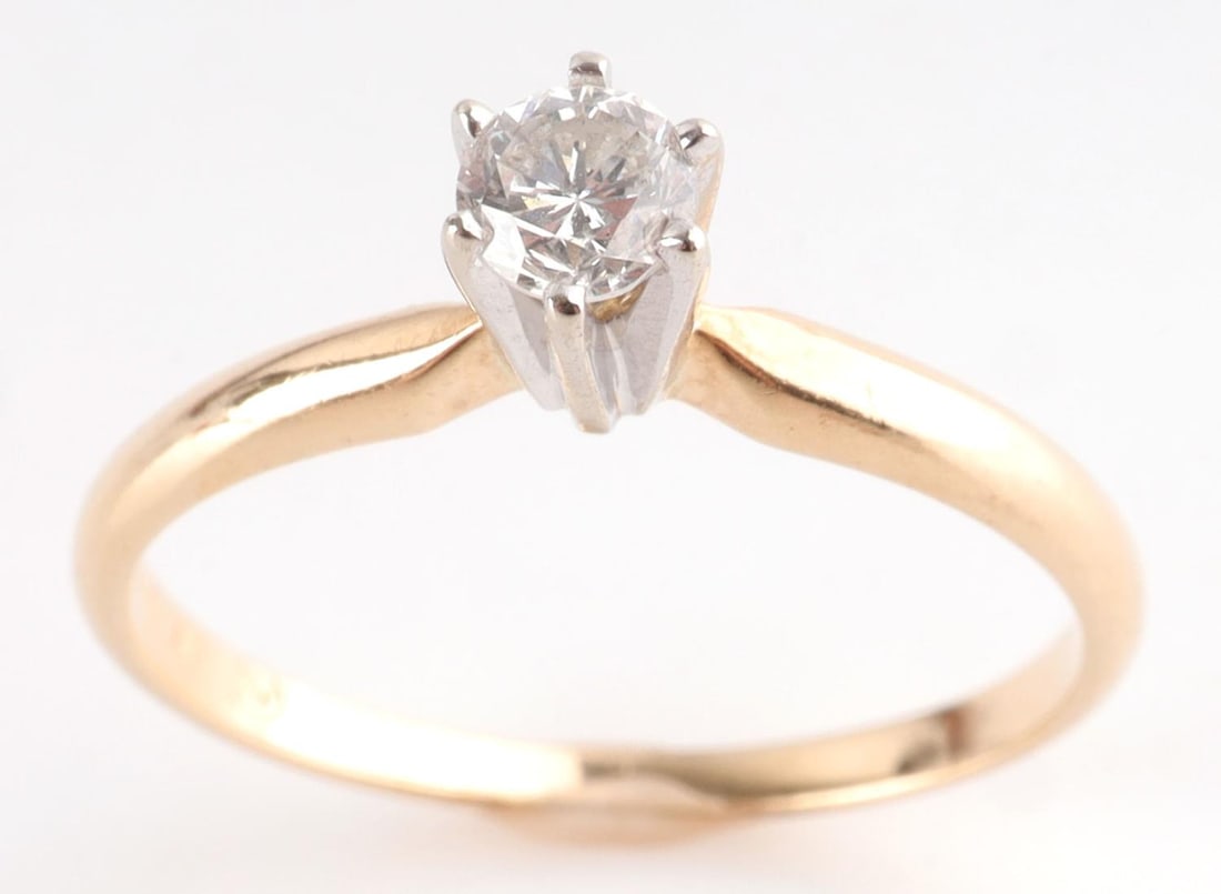 14KT GOLD DIAMOND SOLITAIRE ENGAGEMENT RING: 14kt yellow gold band with white gold 6 prong setting. Diamond is approx. VVS, near colorless, round brilliant cut. It measures 3.8 X 3 mm. Approx 1/4 carat. Size 7-7.25. Total weight 1.8 grams This l