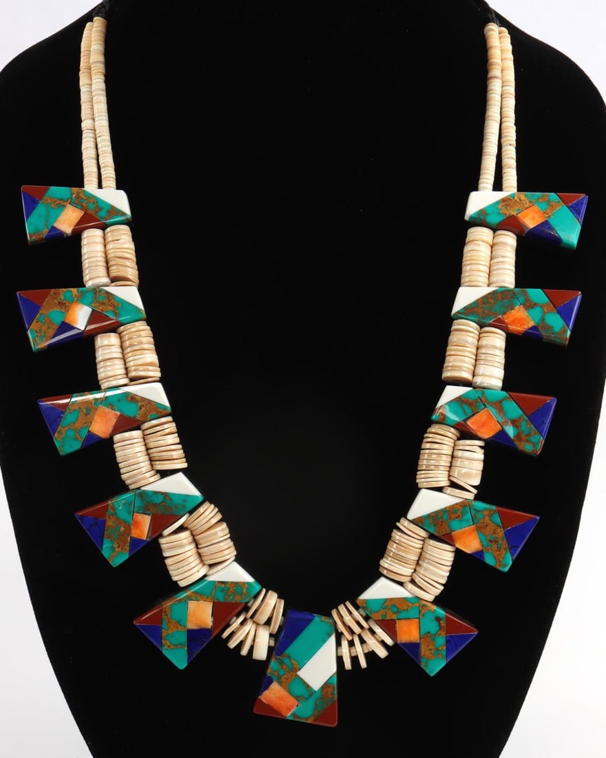 SANTO DOMINGO GEOMETRIC NATURAL STONE NECKLACE: Santo Domingo Geometric Statement Necklace created with spiny oyster, turquoise, carnelian, lapis lazuli, onyx and shell. Length 20-24 inches. Width 1 3/8th inches.