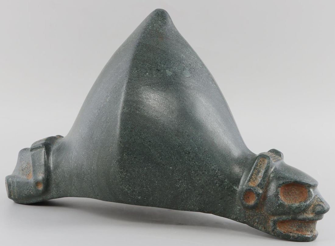 TAINO MONUMENTAL DOG OR BAT HEAD ZEMI CARVING: Taino. PreColumbia. Monumental dog or bat head Zemi. The ear spools indicate zoomorphic content ie. Dog or bat. Both symbolize the underworld. Very heavy. The cone is sharply formed into a diamond sha
