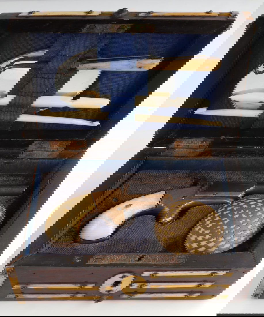 ANTIQUE J M MARLIN PISTOL IN PRESENTATION CASE: Wooden box with derringer 22 short pistol by J.M. Marlin. It comes with bone picks and a mirror. The grips have been replaced on the pistol. FFL or C & R required for transfer. No international shippi