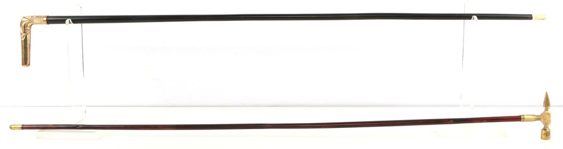 LOT OF 2 ANTIQUE WALKING STICK CANES HAMMER HEAD: Lot of two. Includes a useful hammer hammer head and a point, weapon grade with good brass and steel ferrule tip. The second has a gold plate grip with unusual bone ferrule tip. Both measure 35 inches