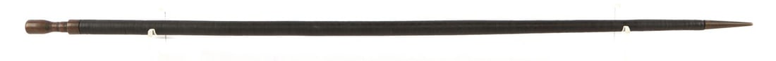 ANTIQUE WEAPON GRADE LEATHER STACK WALKING CANE: Stacked leather discs with copper grip and copper to a point ferrule tip, flexes and could easily be defensive, measures 35 1/2 inches.
