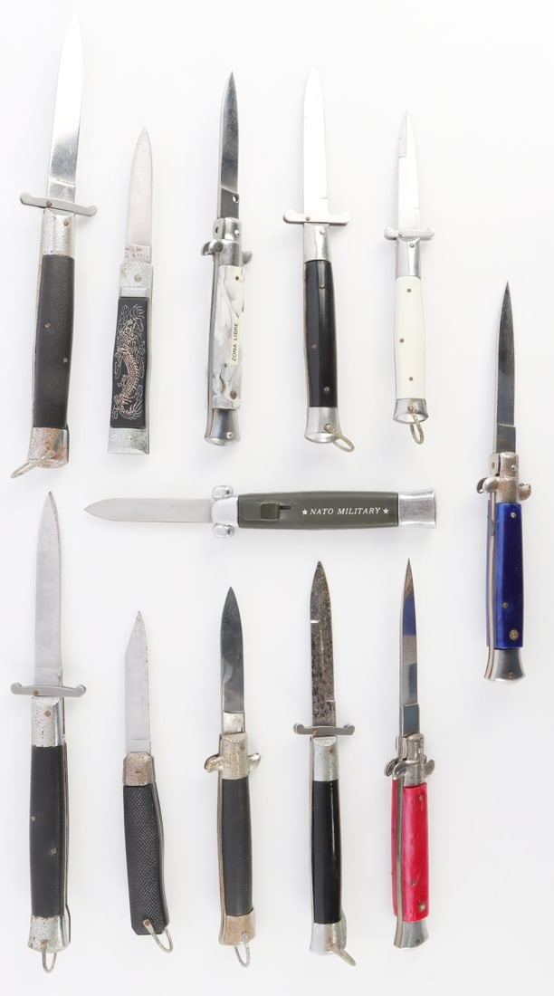 12 SWITCHBLADE KNIFE LOT ITALIAN AND OTHERS: All have strong springs, one is OTF, these were stored in a case for an extended period of time like 20 years, thus the down side on some have pitting not to blades but the fittings, average 7 to 9 in