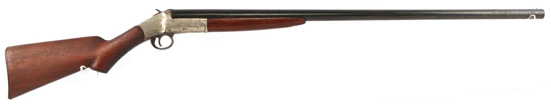 IVER JOHNSON SIDE LEVER 12 GAUGE BREECH SHOTGUN: Barrel measures 32 1/4 inches tall with dark bore with surface loss and some pitting. Mechanically good, functions without issue. Significant finish loss throughout metal and wood. Very small hairline