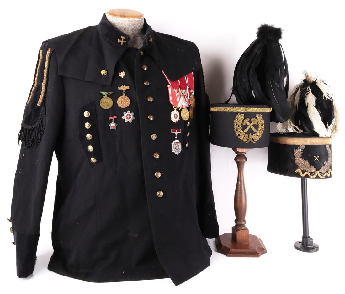 COLD WAR ERA POLISH MINER PARADE GALA UNIFORM LOT: Cold War Era Polish Miner's Gala Parade Uniform including a jacket and two gala hats(one features bullion, other features badge) including their feathers. Jacket features multiple medals and badges in