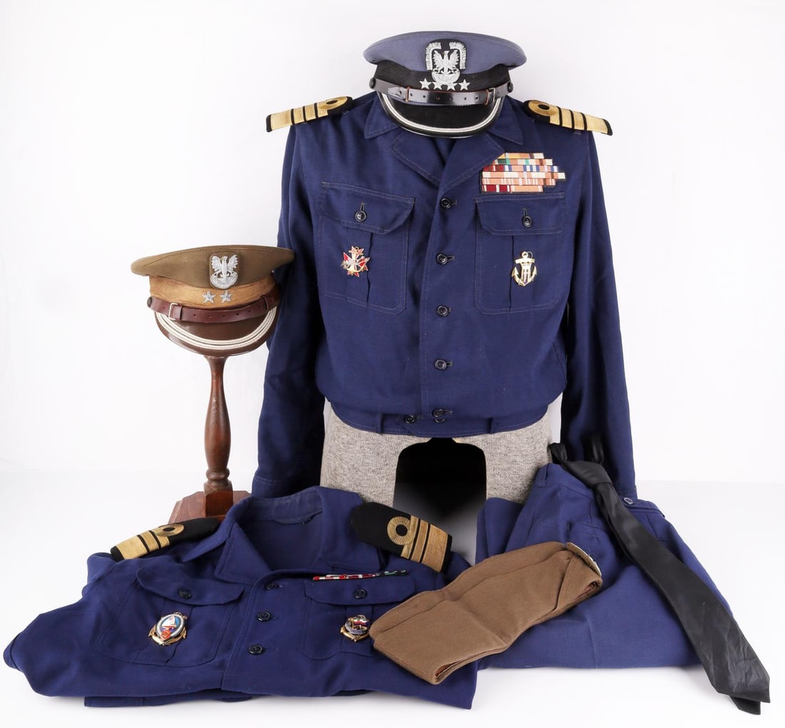 COLD WAR ERA POLISH MILITARY UNIFORM & VISORS LOT: Lot of seven (7) Cold War Polish Military uniforms items including two Polish Navy dress shirts (Commander and Captain), navy pants, a tie, a Navy Visor Cap(Captain), a Army Visor Cap (Second Lieutena