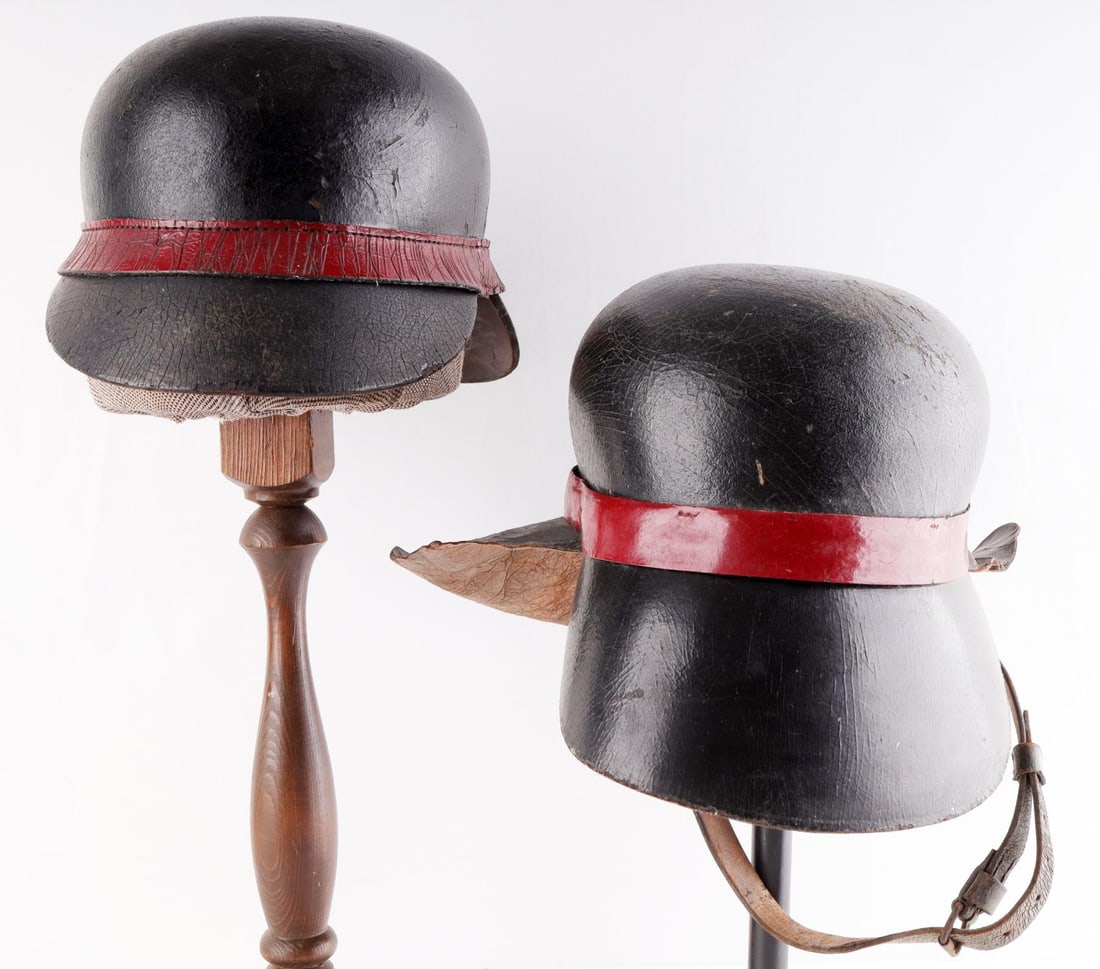 2 WWI IMPERIAL GERMAN FIREMAN FIRE FIGHTER HELMET: Good original condition with chinstraps and liners. Age cracking.