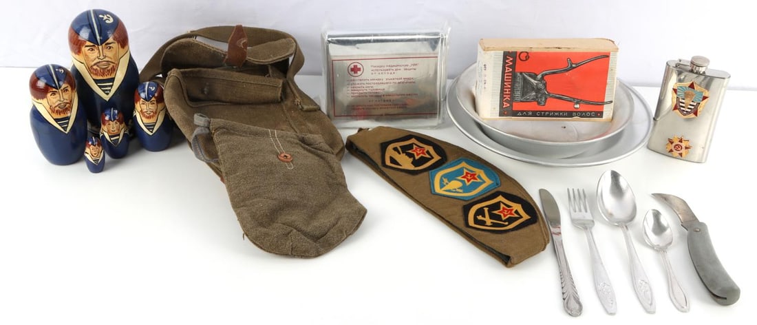 LOT OF 14 SOVIET MILITARIA POUCHES FLASK DOLLS: Soviet paratrooper's flask, 2 WWII pouches 1 is the PPSH drum pouch. Russian navy hand painted and lacquered nesting dolls carved of wood and depicting a Russian naval seaman. 1 side cap. 1 Soviet Arm