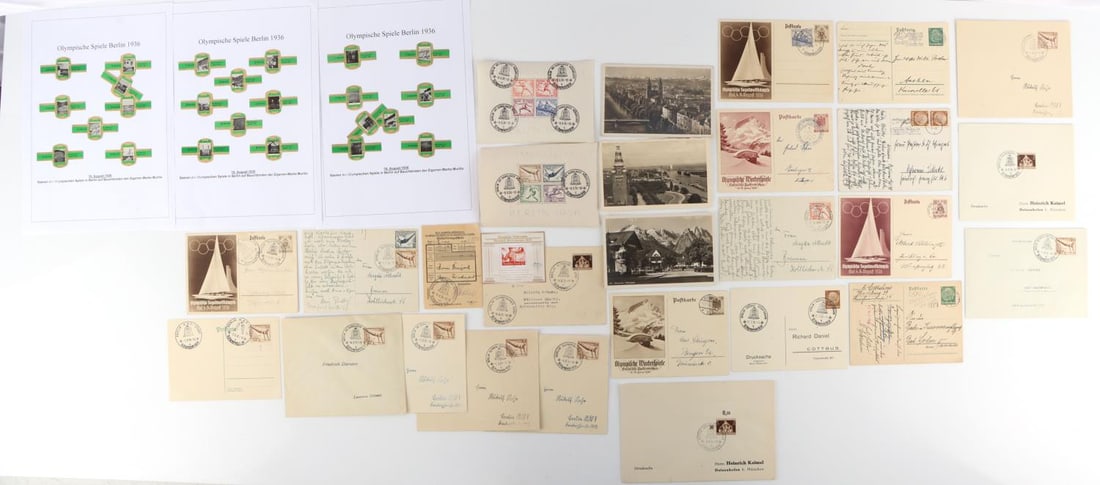 WWII GERMAN THIRD REICH 1936 OLYMPIC POSTCARD LOT: Lot contains 15 postcards and 9 envelopes that are all post marked. Postal money transfer sheet, collection of 1936 Olympic cigarette labels. 2 postal 1936 Olympic sheets with game cancellations. All 