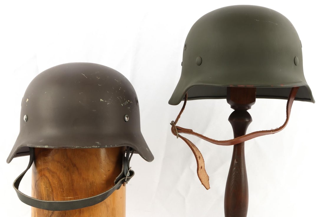 2 GERMAN M40 HELMET POST WAR RESTORATION: Comes with a print add telling where these helmets originated, the grey one had replaced rivets, otherwise complete and as photographed