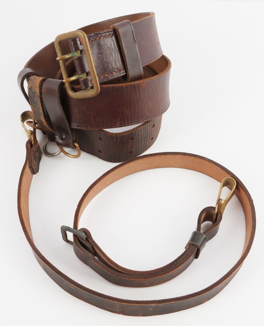 WWII GERMAN THIRD REICH KRIEGSMARINE LEATHER BELT: Brown leather belt. Marked Luneschloss Solingen. DRGM marked on clasp. Also marked Croupon 197. Measures 43 inches. Very good condition with age wear.