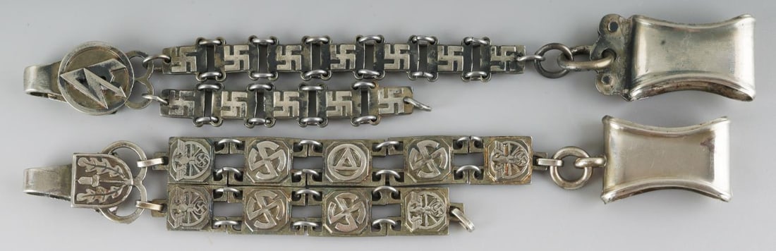 2 WWII GERMAN THIRD REICH DAGGER HANGERS SA & NSKK: WWII German Third Reich dagger hanger lot. Hanger for a SA dagger and one for a NSKK dagger. Both in very good condition and both are 12 inches in length. Unauthenticated and sold as is. This lot has