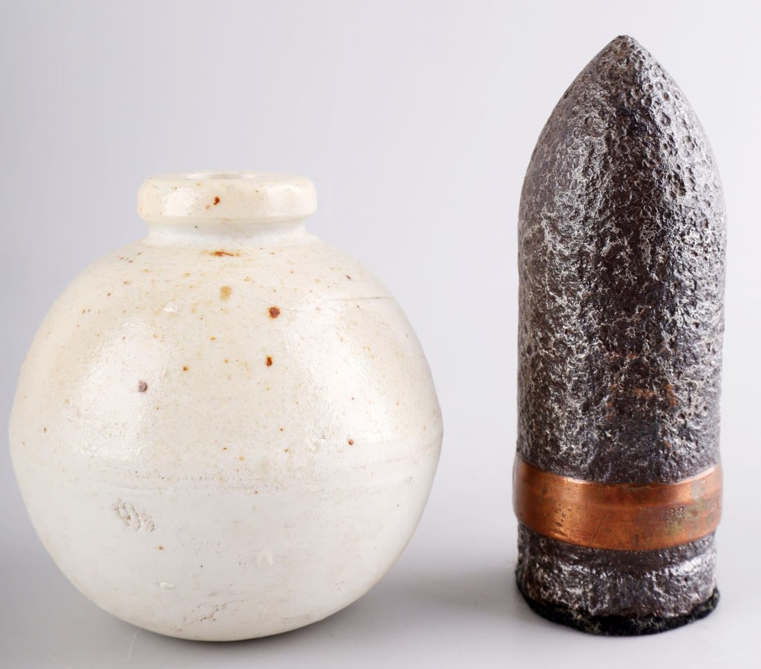 WWII GERMAN MARKED ARTILLERY & JAPANESE GRENADE: Lot of two (2) WWII items including a German Reich Artillery ordnance trench art with Waffenamt mark, "WaA447". Second item is an Imperial Japanese Type 4 Ceramic hand grenade. Lot is in good conditio