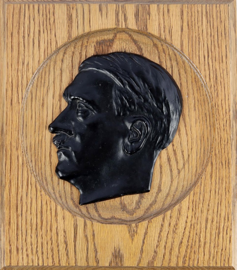 WWII GERMAN REICH ADOLF HITLER WOOD WALL PLAQUE: WWII German Reich Adolf Hitler Black Plaque with Wooden wall mount. No visible markings on either side of mount. Backside has hook for mounting. Size approx. 9.5 X 10.75 inches. Good condition. Unauth