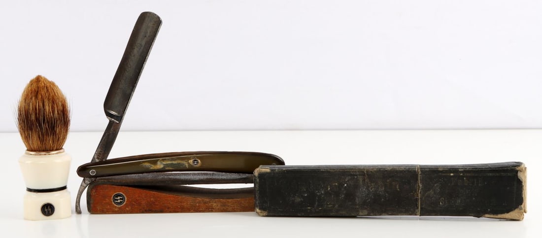 WWII GERMAN THIRD REICH SHAVING RAZOR BRUSH LOT 3: WWII German Third Reich shaving lot. Shaving brush, razor in a box and leather razor sharpener. Dimension: Brush 3.5, razor 6.5 and strap is 7 inches. Unauthenticated and sold as is. This lot has a re