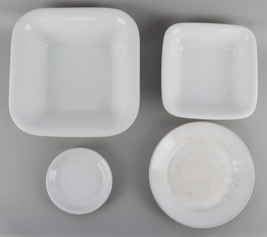 4 WWII GERMAN REICH LUFTWAFFE PORCELAIN DINNERWARE: Lot of four (4) WWII German Reich Luftwaffe Porcelain dinnerware including two square bowls, a saucer, and lastly a plate. Each item's underside features the Luftwaffe eagle and "Fl. U.V.". Manufactur