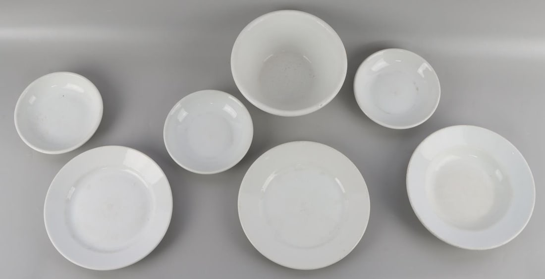7 WWII GERMAN REICH HEER ARMY PORCELAIN PLATE LOT: Lot of seven (7) WWII German Reich Heer Army Porcelain dinnerware lot including six plates and one bowl. Each porcelain item features the NSDAP/Heer Army eagle insignia and manufacturer marks. Makers 