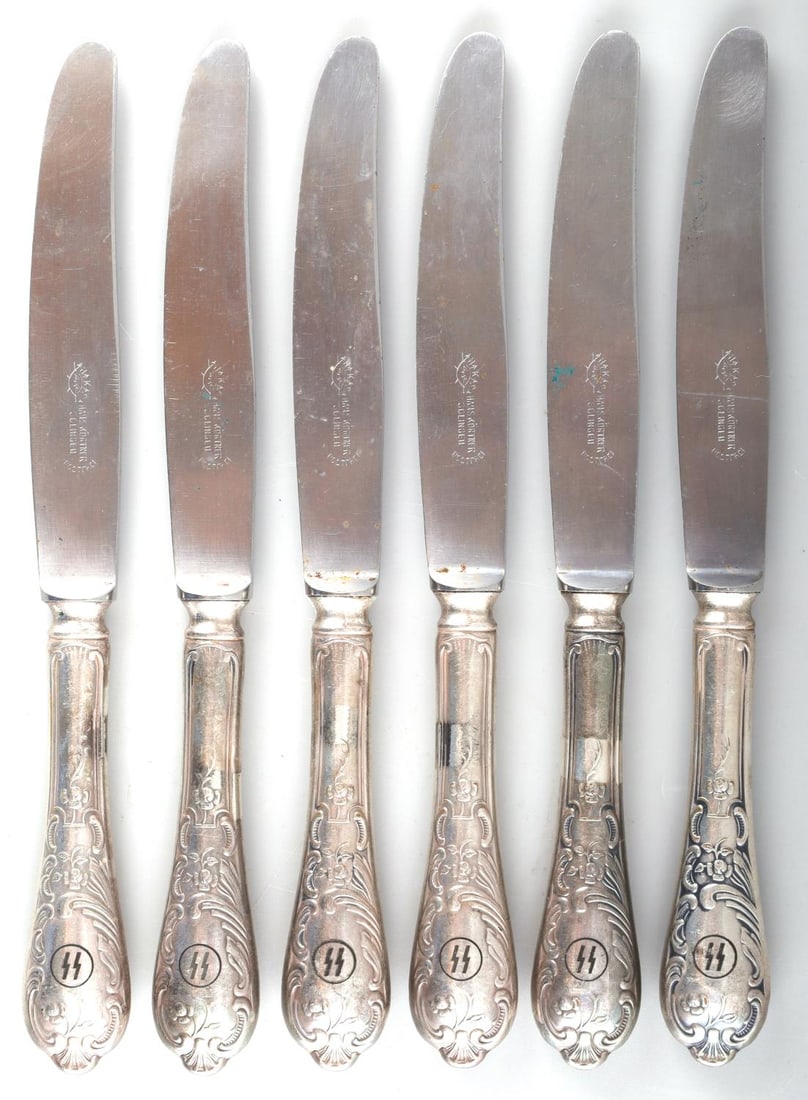 6 WWII GERMAN THIRD REICH SS TABLE KNIFE LOT: WWII German SS knife lot of 6. All blades stamped with Hans Kortner Solingen and SS stamped on the handle. Dimension: 9.75 X 1.25 inches and in very good condition. Unauthenticated and sold as is.