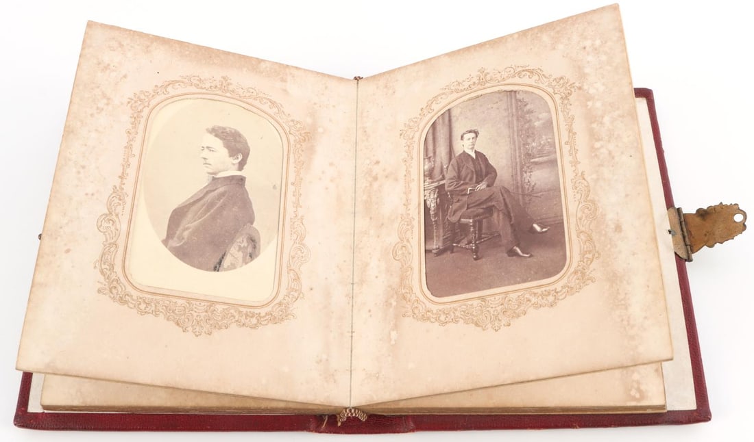 19TH CENTURY PHOTOGRAPH ALBUM CDV & TINTYPE: Book measures 4 1/2 X 6 inches and contains 16 CDV and 5 tintypes, all very good, Northeast U.S. photography studios, of individuals.