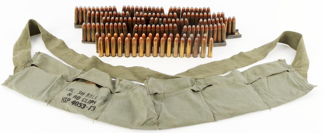 LOT OF 94 ROUNDS 30 CARBINE R-P SOFT POINT AMMO: Lot of ninety-four (94) rounds of 30 Carbine Soft Point ammunition with a headstamp that reads, "R-P 30 CARBINE". Includes six M1 Carbine stripper clips. Lot also includes a magazine belt pouch stampe