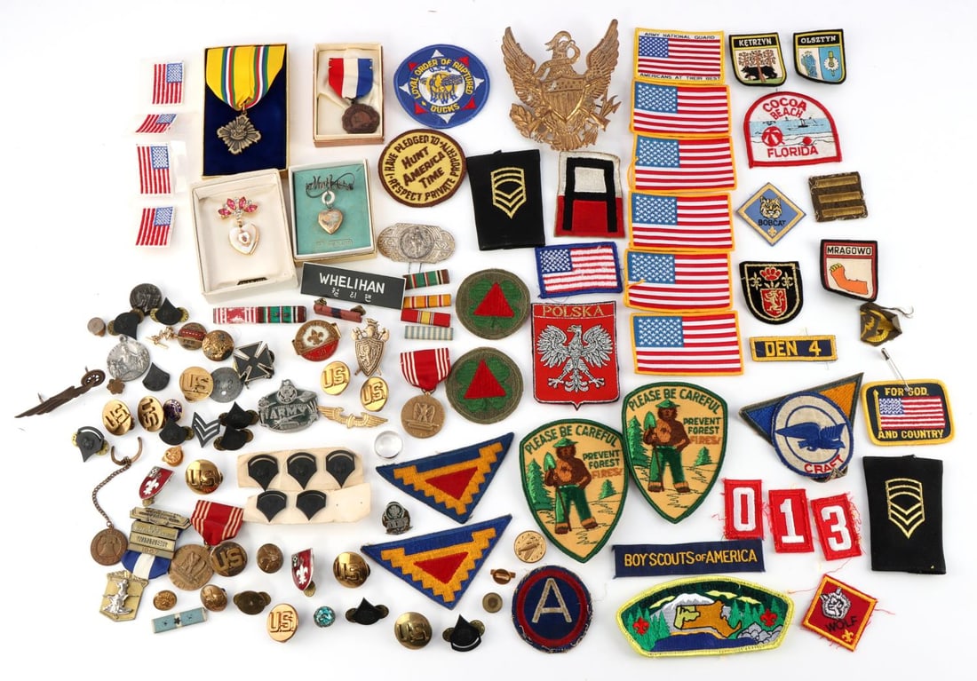 LARGE LOT ASSORTED MILITARY PATCHES PINS RIBBONS: Assorted military patches and pins. Includes "Sweetheart locket", honor medals, U.S. military pins and ribbons, Ruptured Ducks patches, Smoky the Bear patches, Polish patches, and veteran patches, rib