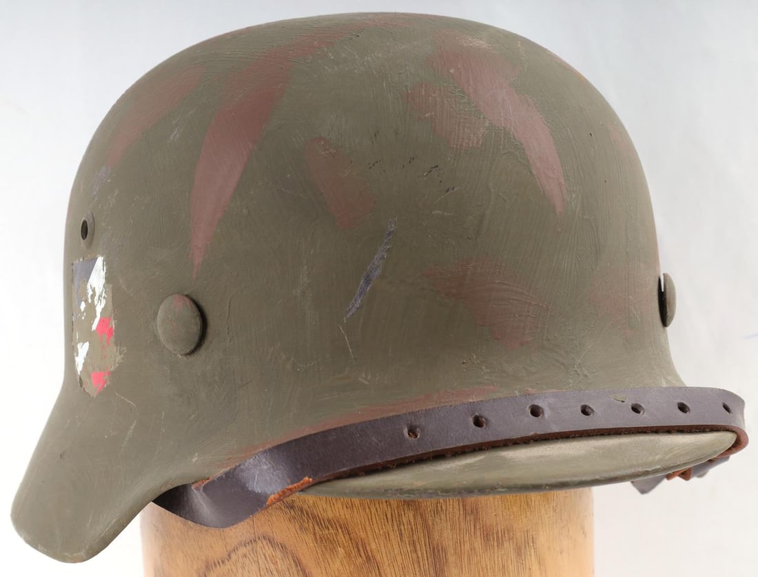 WWII GERMAN THIRD REICH M38 HEER HELMET: Original helmet, remanned, new liner, chinstrap, and de Nazified decals, internal stampings are obscures.