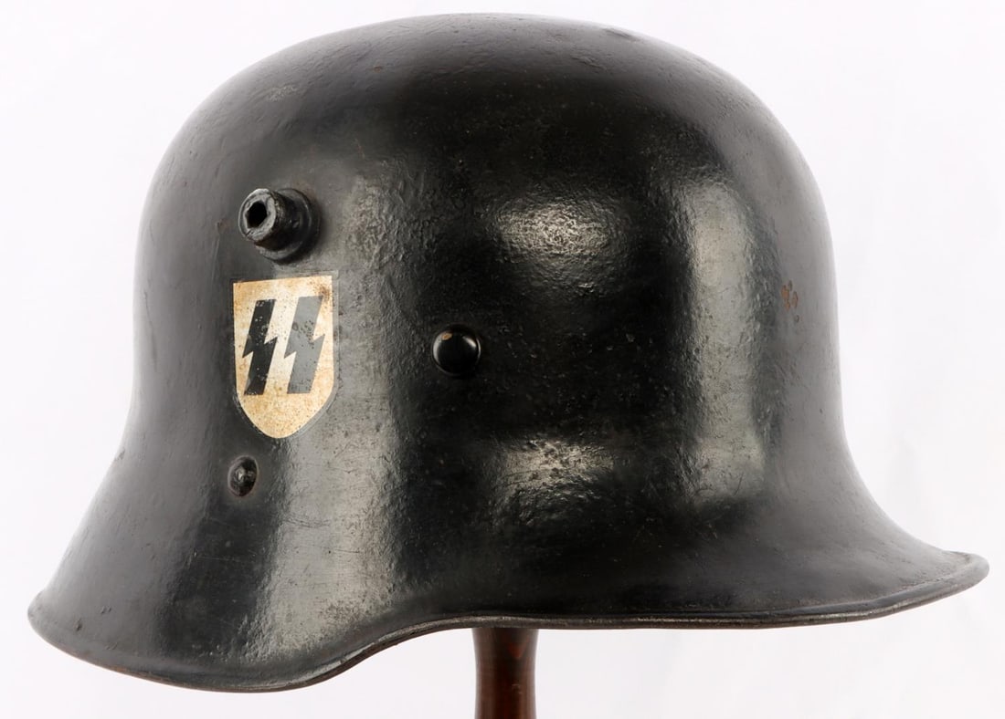 WWII GERMAN ALLGEMEINE SS DOUBLE DECAL HELMET: Allgemeine SS/SS - VT double decal helmet. Austrian M1916 shell with 85% of the original black finish. "SS" decal would rate 95%, the swastika shield 95%. No chinstrap or lining. 09-W stamped on the i