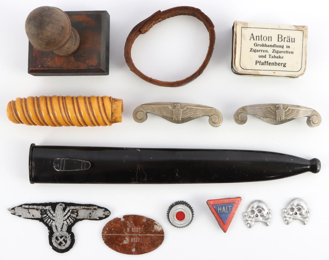 WWII GERMAN THIRD REICH PARTS LOT DAGGER & MORE: Lot features a bayonet scabbard, denazified army dagger crossguard, Bakelite army dagger grip, a Parteiadler patch, panzer totenkopfs, and more. Very good condition. From a WWII vet estate.