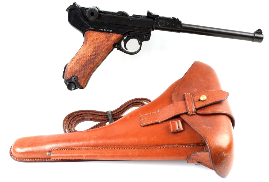 WWII GERMAN REICH PROP P08 LUGER PISTOL W HOLSTER: This is a prop gun, not a firearm. WWII German Reich P08 Luger Prop Pistol including a leather holster. Pistol is marked, "938", to one side and "DENIX, MADE IN SPAIN" on the other. Includes one magaz