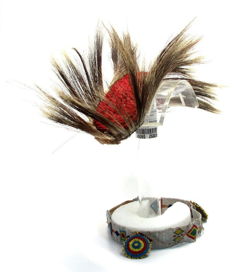 NATIVE AMERICAN ROACH HORSE HAIR HEADDRESS: Native American Roach horse hair headdress and beadwork head band. These headdresses were typically worn by warriors or dancers. Measures 16 inches long, 3 inches at widest point. Beaded headband feat