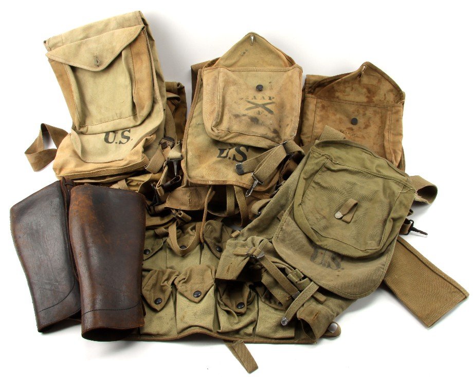 LOT OF WWI & WWII MILITARY HAVERSACKS AND GEAR: Authentic US issued gear consigned from a costume company that supplied many movies with uniforms and props. Included are five haversacks by R.I.A. (1918), Wiley, Bickford, Sweet, Co. (1918) and Boyt 