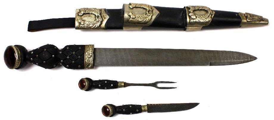 SCOTTISH REGIMENTAL OFFICER'S JEWELED DIRK: Scottish Highland Regimental Officers Dirk with an 11.5 inch Damascus steel blade with knife and fork and simulated cairngorm stone. 19.5 inches overall. The blade has no pitting or nicks, metalwork h