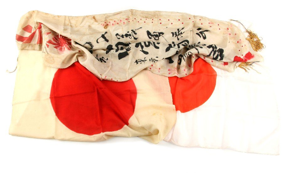 WWII IMPERIAL JAPANESE BANNER AND TWO FLAGS: WWII Imperial Japanese banner, with two Imperial flags, one cotton and one silk. Slight tears in banner, both flags are in very good condition.