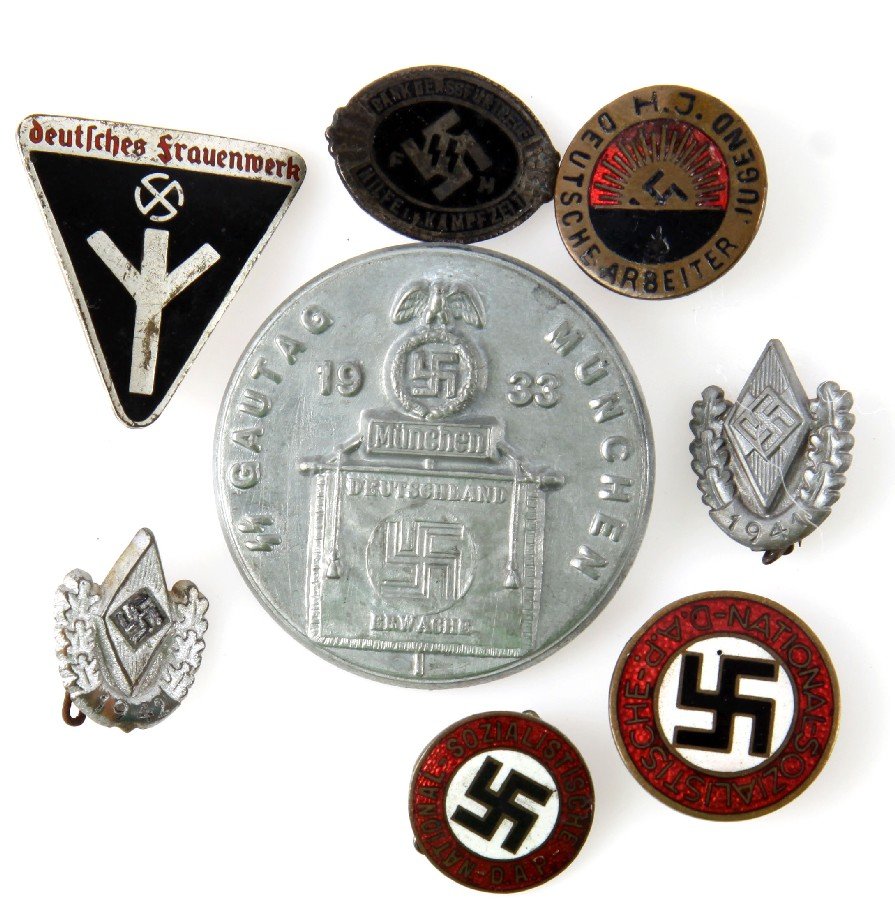 GROUPING WWII GERMAN PINS & TINNIES HJ SS & MORE: Grouping of seven WWII German items. HJ pin, two NSDAP pins, German Womens Order pin SS FW stickpin, and more. All in good to very good condition. 8 in all.