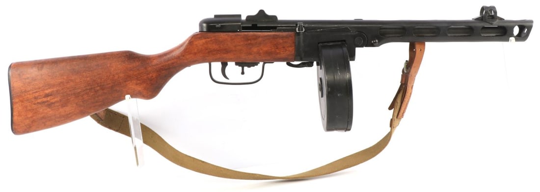 PROP RUSSIAN PPSH41 SUBMACHINE GUN W DRUM: PROP Russian, PPSH-41, submachine gun with drum magazine. Hooded front sight. Gun has no visible markings. Drum magazine is removable. Slide action locks and releases properly. Barrel is sealed. Inclu