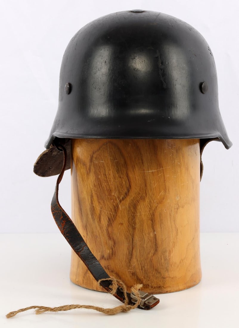 WWII GERMAN REICH M34 FIRE POLICE STAHLHELM HELMET: WWII German Reich double decal M34 fire police Stahlhelm helmet. Right side of the exterior features a swastika decal, left side features a German Flag decal. Interior features a leather neck flap, a 