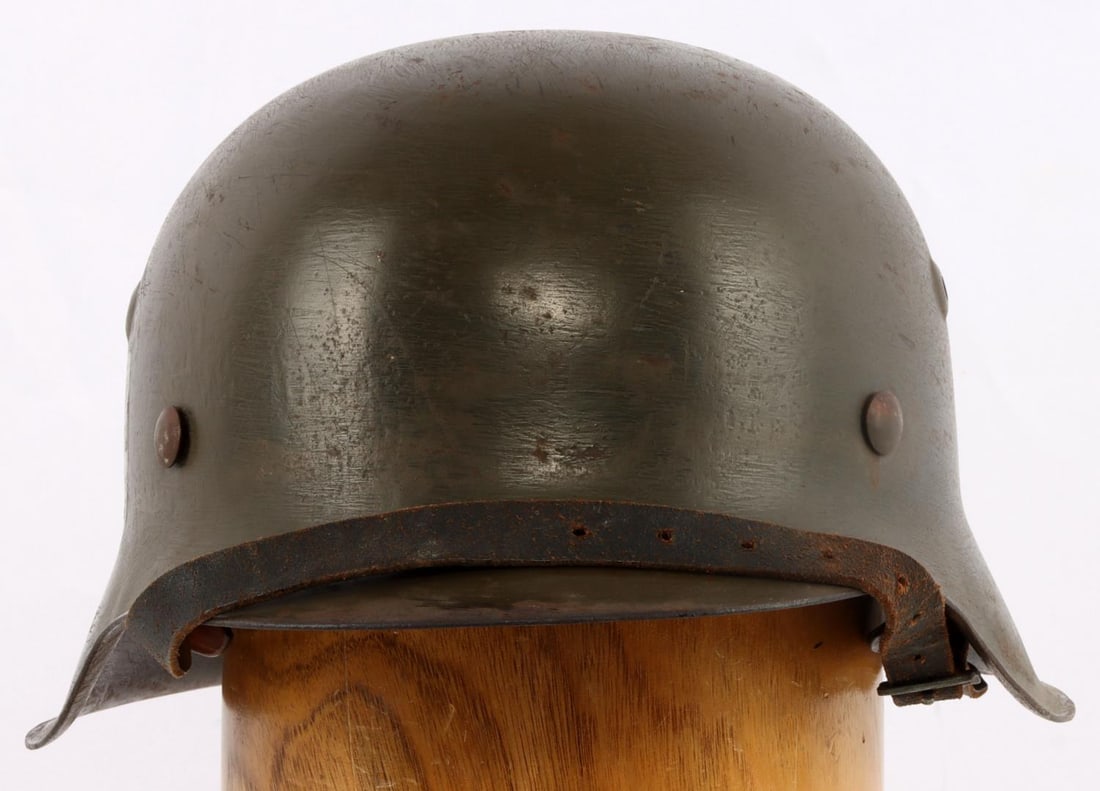 WWII GERMAN SS M42 STAHLHEIM HELMET: Complete with chinstrap and liner, rear impressed hkp64, over 3407, external scratches, otherwise good original condition.
