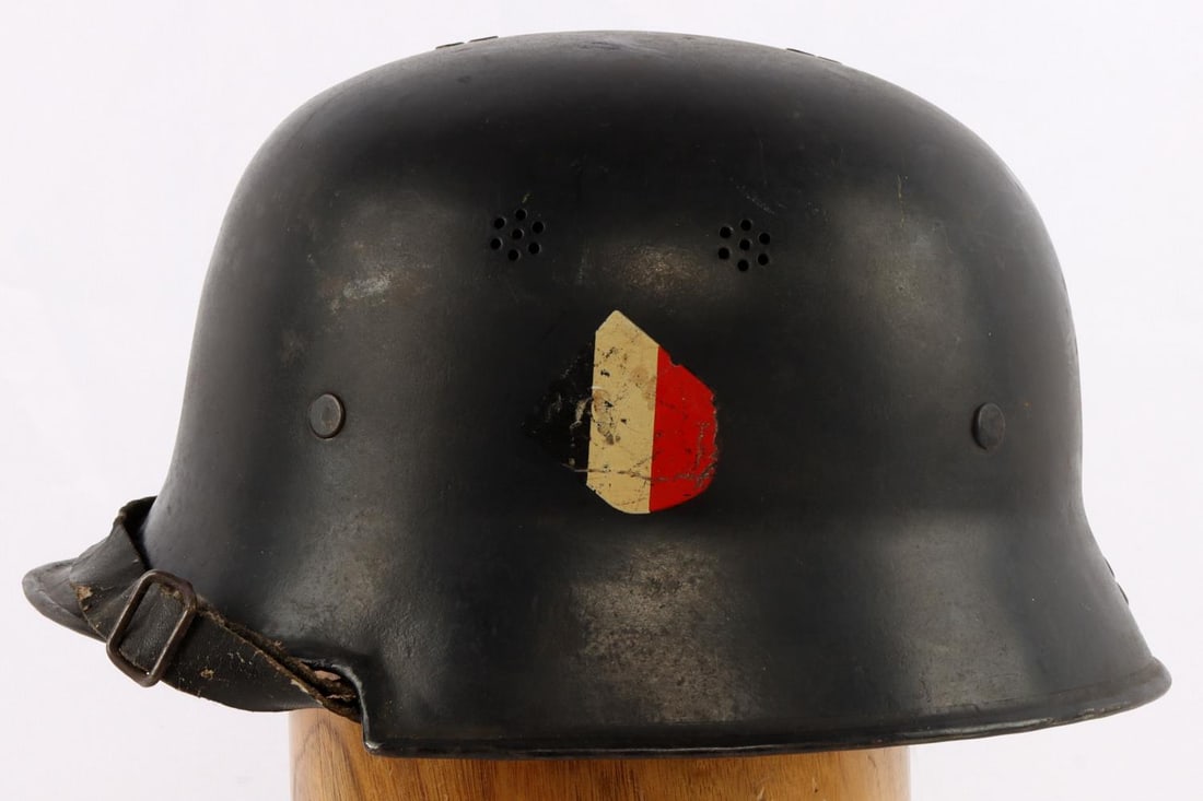 GERMAN M34 PRE WAR SLANTED INSIGNIA FIRE HELMET: DRP Thale stamped inside reverse, moderate wear , complete and rare example.