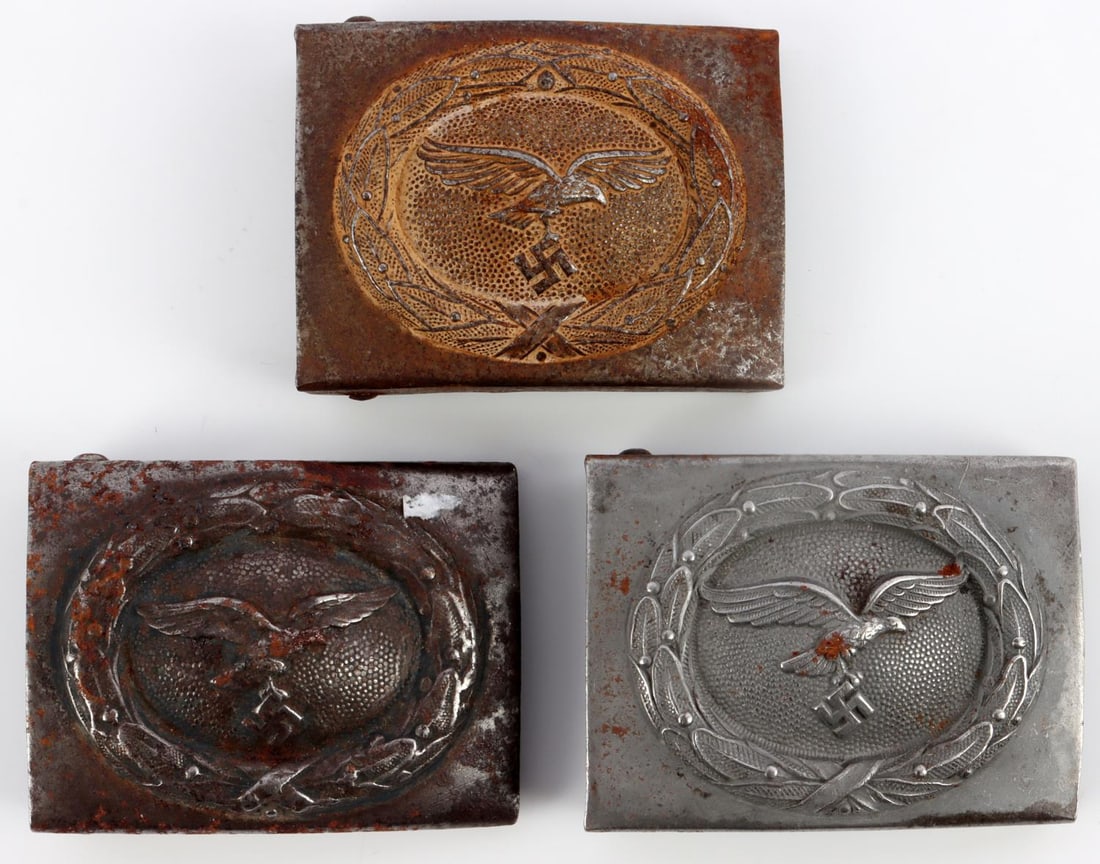 LOT 3 WWII GERMAN REICH LUFWAFFE EM BELT BUCKLES: Lot of three (3) WWII German Reich Luftwaffe enlisted men belt buckles. Each belt buckle is steel constructed, magnetic. No visible markings on the reverse of each. Each buckle has oxidation and tarni