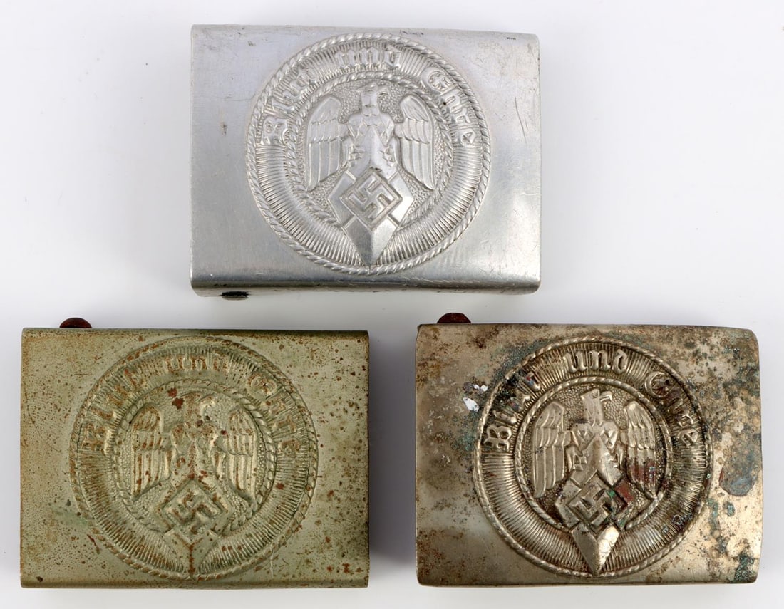 LOT 3 WWII GERMAN REICH HITLER YOUTH BELT BUCKLES: Lot of three (3) WWII German Reich Hitler Youth (Hitlerjugend) belt buckles. Two belt buckles are nickel silver construction with the prongs being magnetic, the other is aluminum. Each has a visible m
