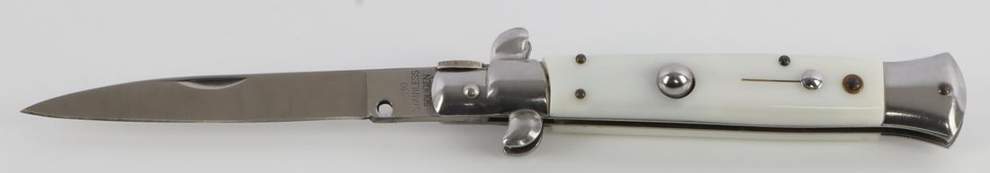 GERMAN SWITCH BLADE ASSISTED KNIFE SOLINGEN MAKE: 440 stainless steel. Ivory white grips. Measures 8 5/8 inches.